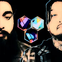 two men with beards standing next to each other